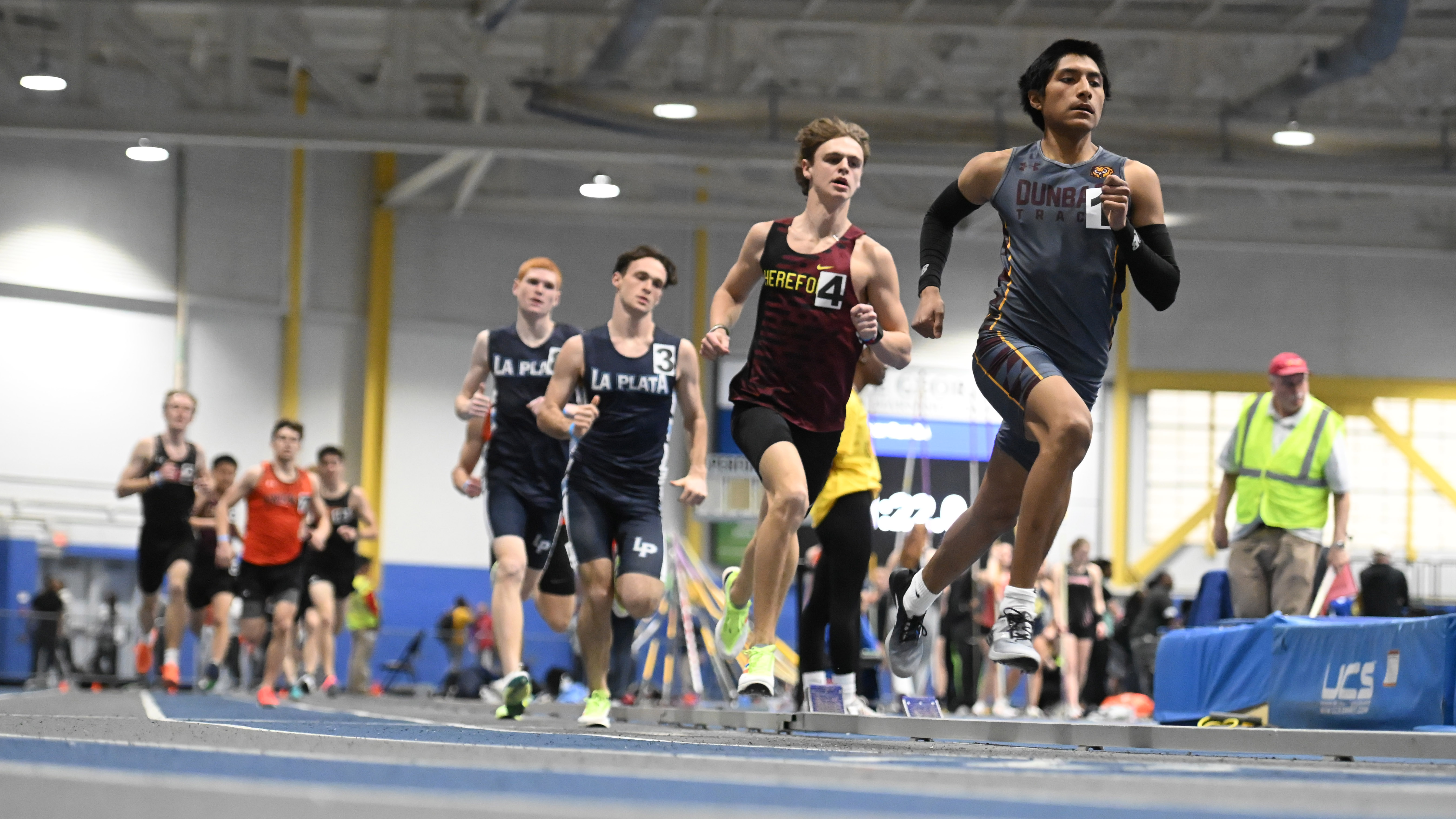 Dunbar's William Carranza leads Hereford's Eli Aitken and the rest of the field in the 2A boys 1600 meter run during the track and field state championships at Prince Georges' Sports Complex on Wednesday. (Brian Krista/Staff)