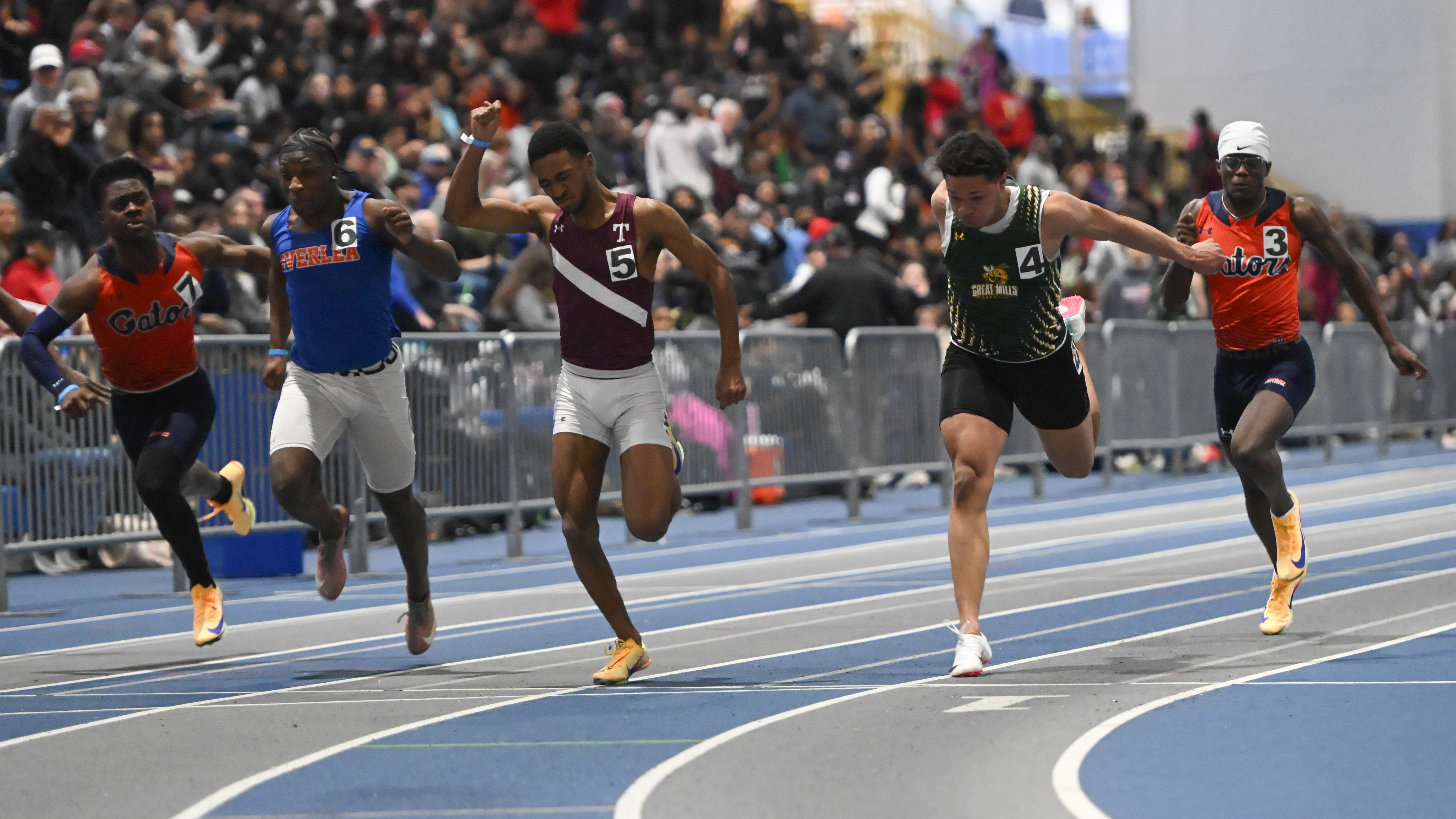 Towson's Bronte Morton, center, edges out the competition in the final of the 3A boys 55 meter dash during the track and field state championships at Prince Georges' Sports Complex on Wednesday. (Brian Krista/Staff)