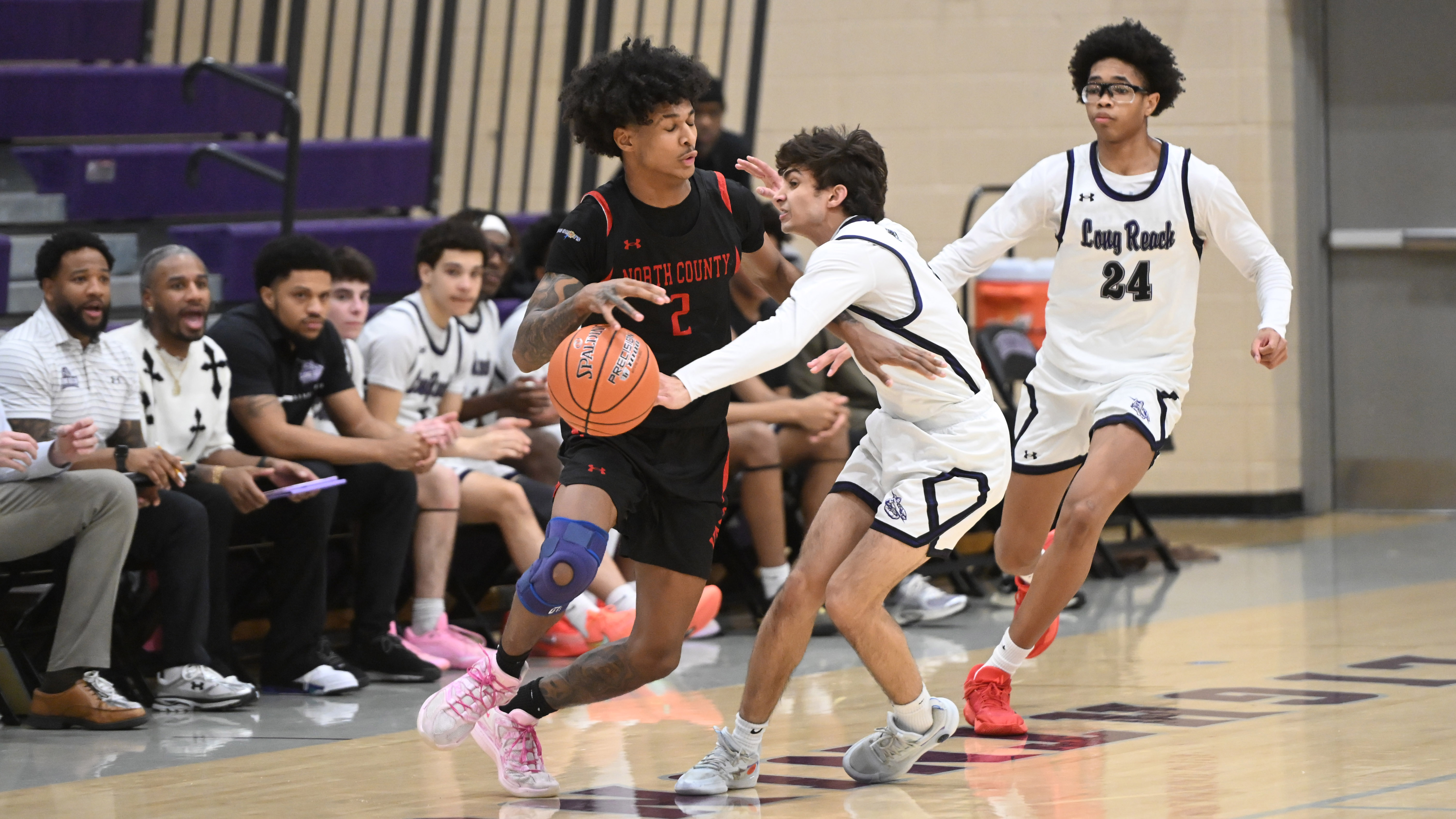 Long Reach's Suhaan Stewart tries for a steal against North...