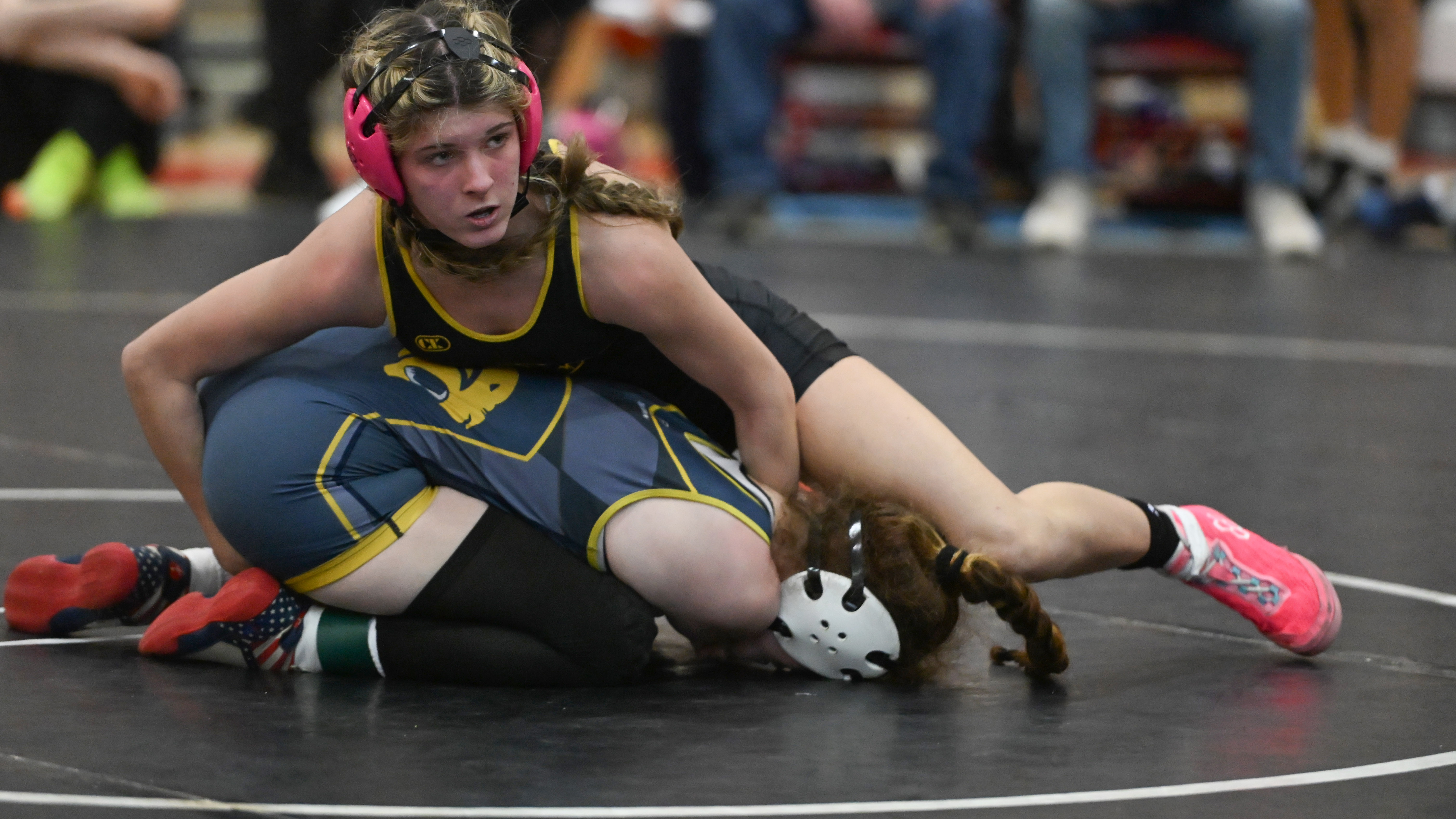 Harford Tech's Sofie French, top, battles with Perryville's Saphira Hamill in the girls 115 pound final during the UCBAC wrestling championships at Edgewood High School on Saturday. (Brian Krista/Staff)