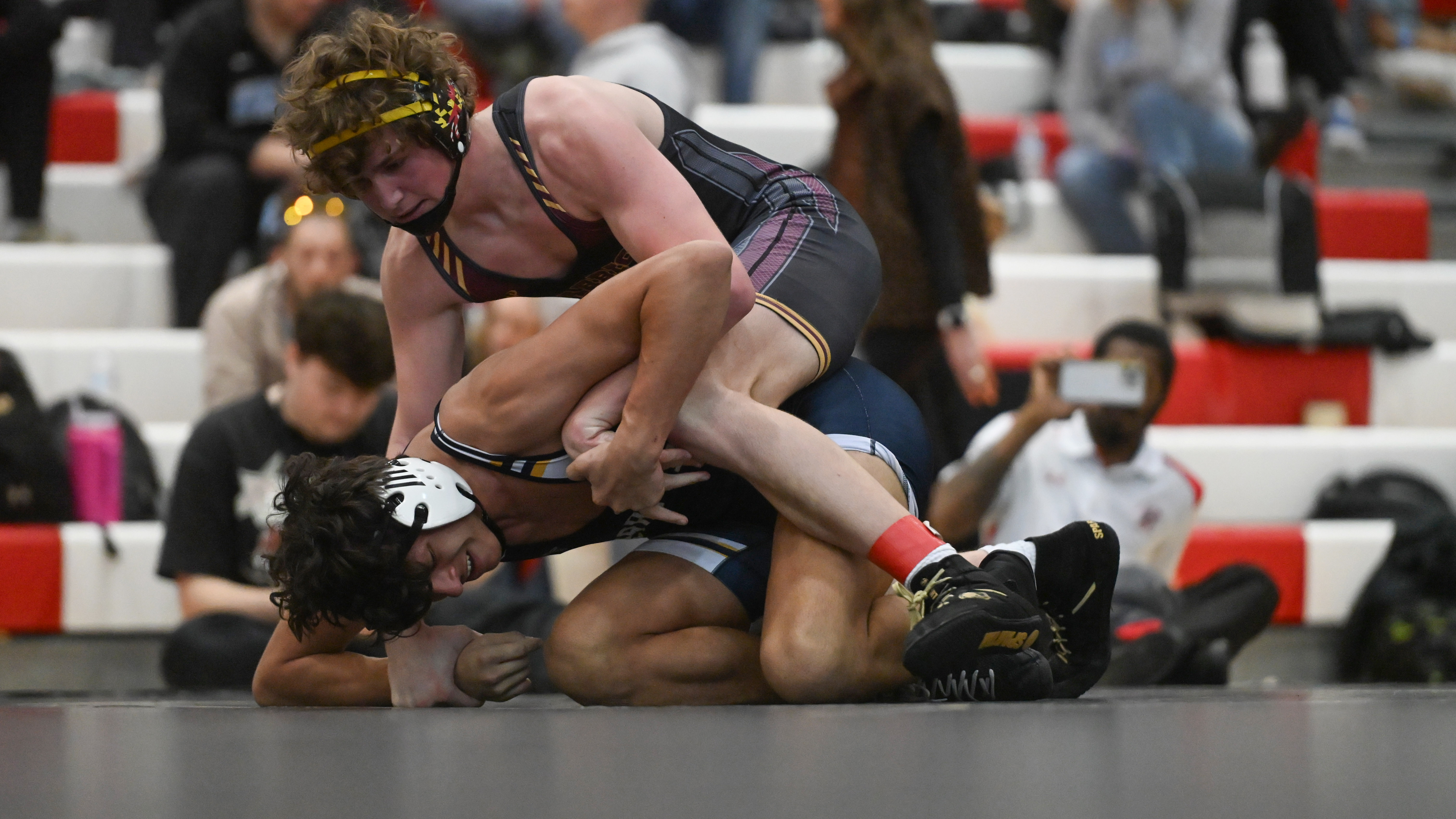 Havre de Grace's Slayton Samuels controls Perryville Devon Landis in the 165 pound final during the UCBAC wrestling championships at Edgewood High School on Saturday. (Brian Krista/Staff)