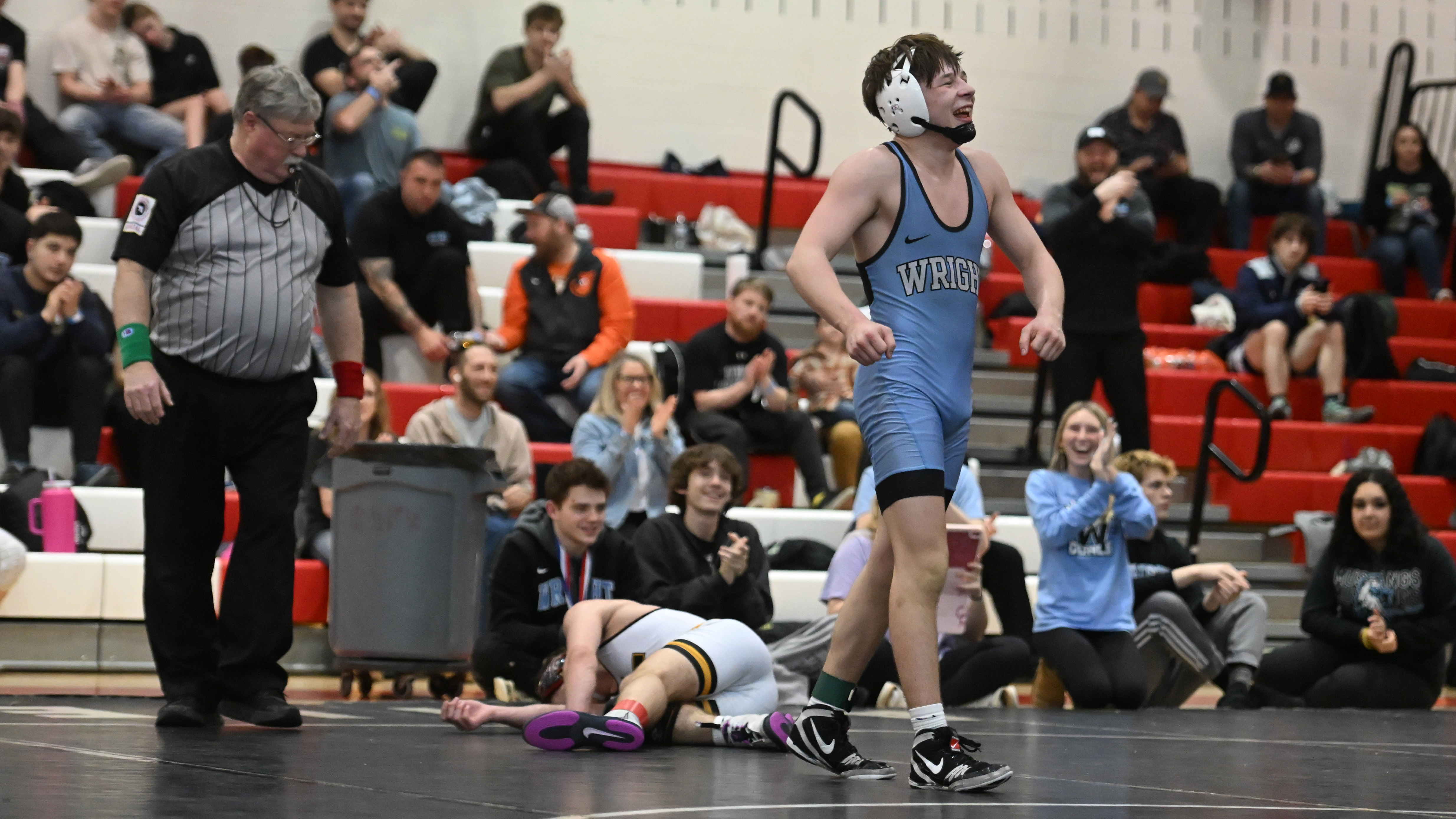 C. Milton Wright's Jacob Cox celebrate victory over Harford Tech's Cameron Moore in the 126 pound final during the UCBAC wrestling championships at Edgewood High School on Saturday. (Brian Krista/Staff)
