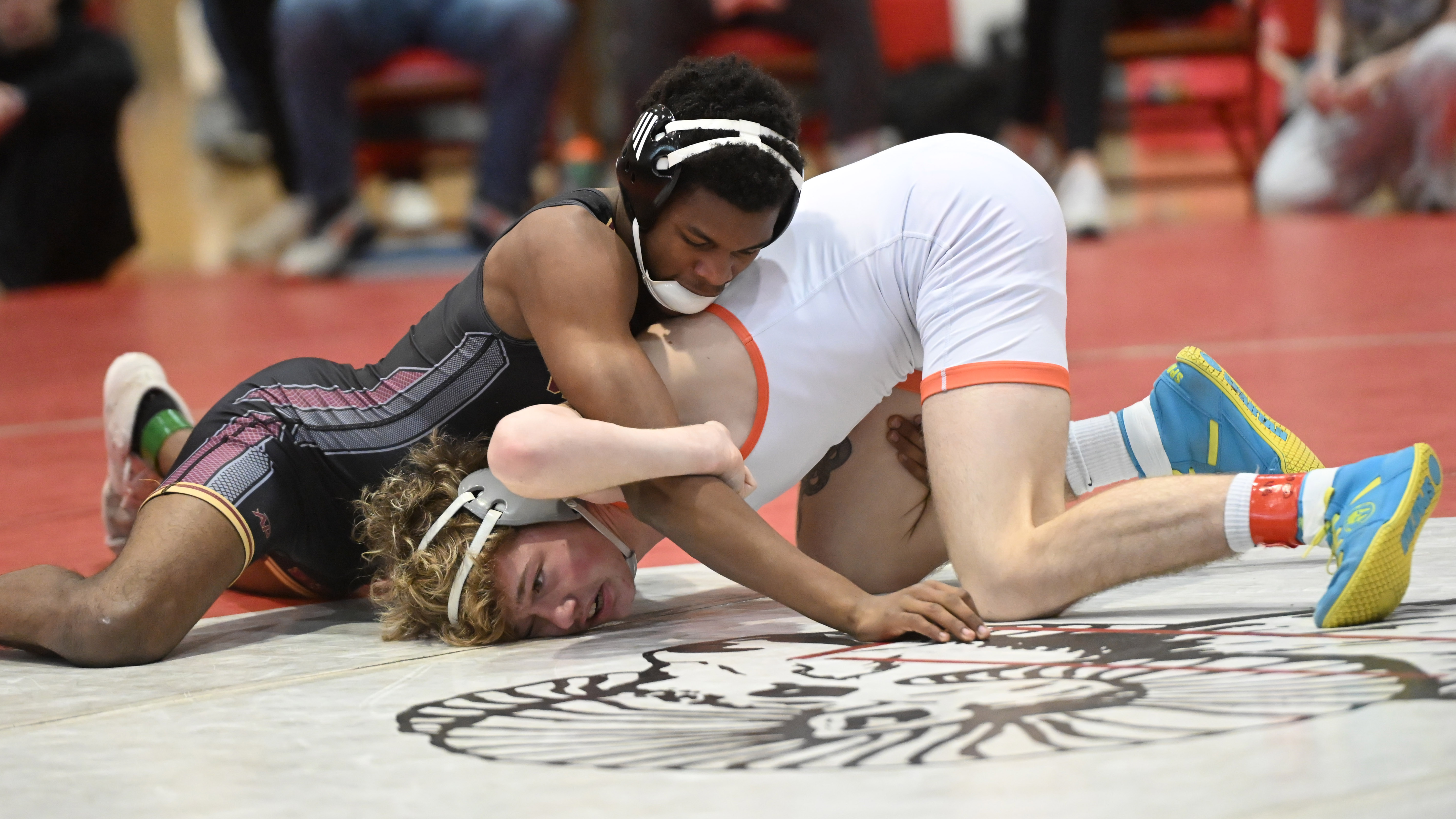 Havre de Grace's Brendon Brown, left, and Rising Sun's Adan Stewart compete in the 132 pound final during the UCBAC wrestling championships at Edgewood High School on Saturday. (Brian Krista/Staff)