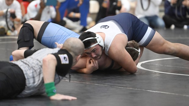 Bel Air's Owen Reilly tries to pin C. Milton Wright's Cameron Stepp in the 285 pound final during the UCBAC wrestling championships at Edgewood High School on Saturday. (Brian Krista/Staff)