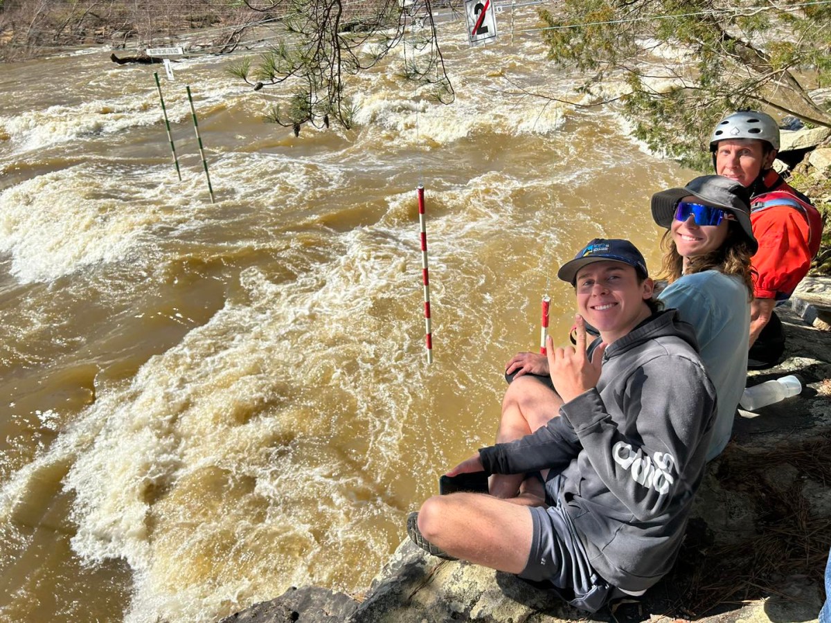 People watching the race course from a rocky bluff at the Alabama Cup Races in Blount County, Alabama.