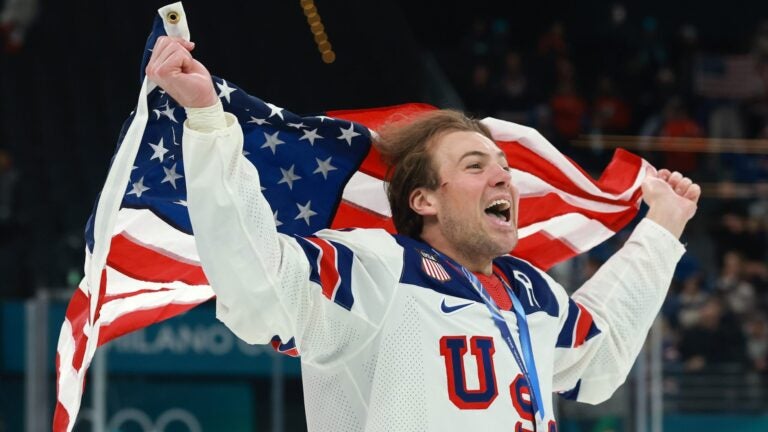 MILAN, ITALY - FEBRUARY 22: Gold medalist Charlie McAvoy #25 of Team United States celebrates after the medal ceremony for Men's Ice Hockey following the Men's Gold Medal match between Canada and the United States on day 16 of the Milano Cortina 2026 Winter Olympic games at Milano Santagiulia Ice Hockey Arena on February 22, 2026 in Milan, Italy.