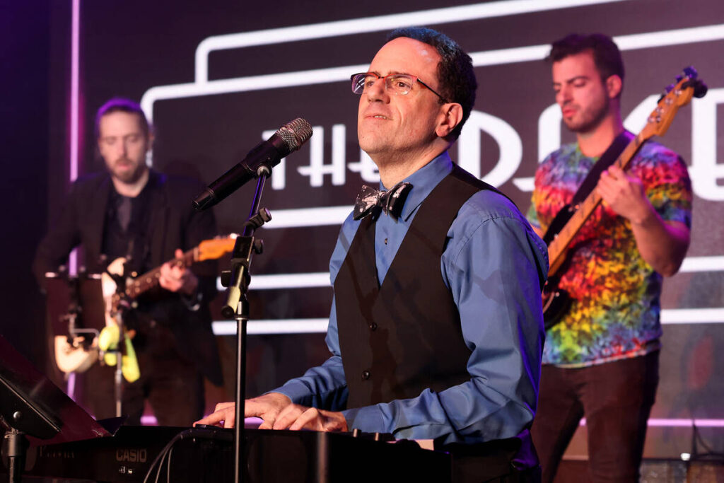 Producer and band leader Kenny Davidsen sings during a birthday party benefit for Las Vegas Rev ...
