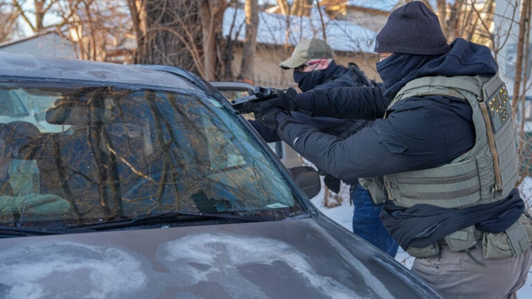 Immigration agents draw guns, arrest activists following them in Minneapolis