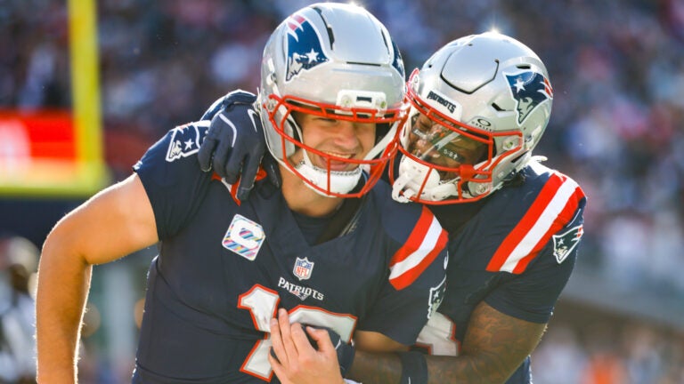 New England Patriots quarterback Drake Maye (10) celebrates with wide receiver Stefon Diggs (8) after a touchdown during the second half of an NFL football game against the Cleveland Browns, Sunday, Oct. 26, 2025, in Foxborough, Mass.