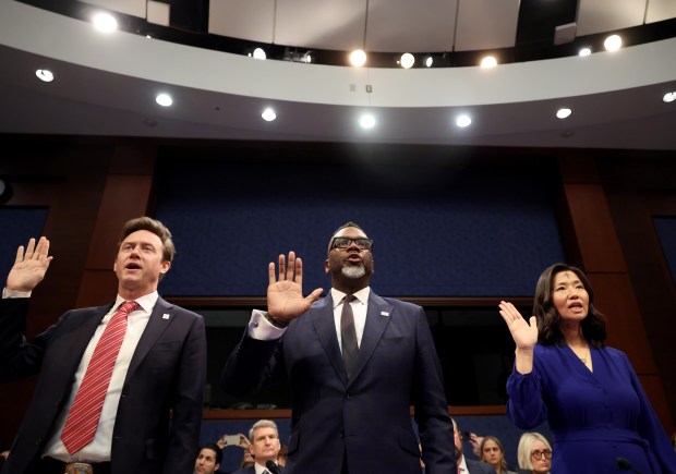 Chicago Mayor Brandon Johnson, center, is sworn in with Denver Mayor Mike Johnston and Boston Mayor Michelle Wu in front of the House Committee on Oversight and Government Reform on March 5, 2025, in Washington. (Brian Cassella/Chicago Tribune)