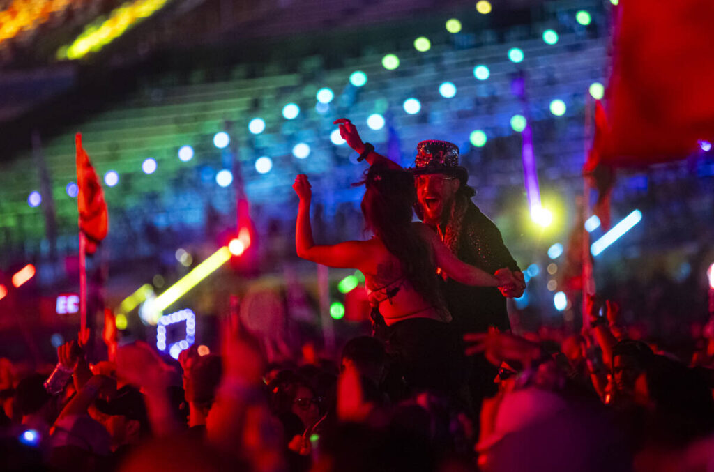 Attendees dance at the Cosmic Meadow stage during the final night of the Electric Daisy Carniva ...
