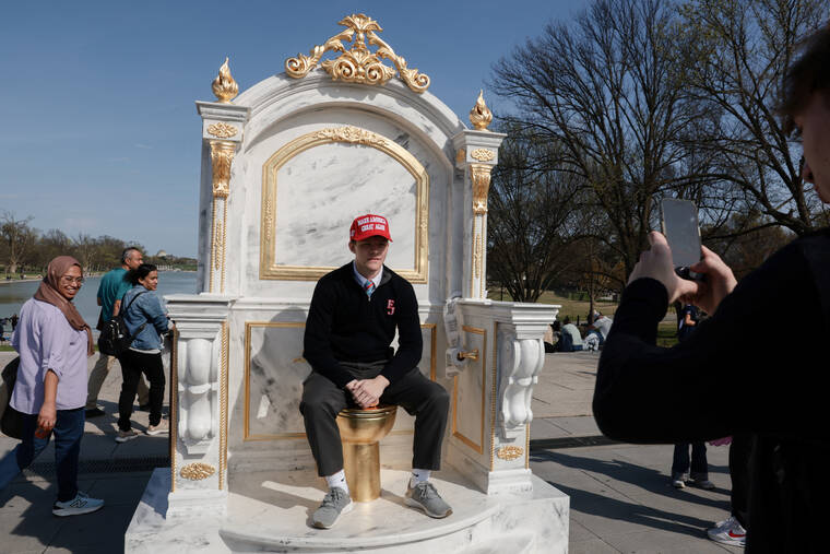 Golden toilet mocks Trump decor as White House defends renovations