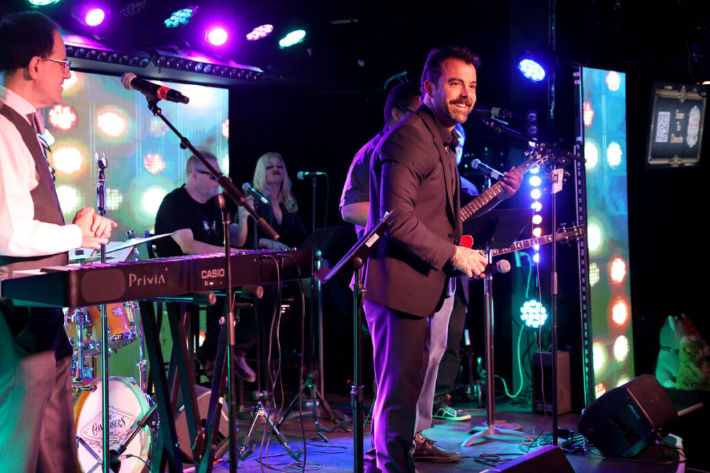 Franky Perez entertains the crowd during the annual John Katsilometes birthday party fundraiser ...