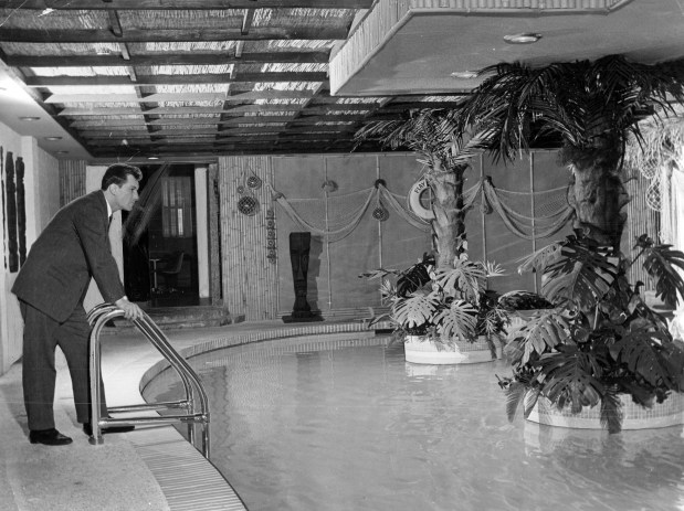 Playboy magazine founder Hugh Hefner admires the pool in the basement of his apartment at 1340 N. State Parkway in Chicago on April 20, 1961. (Arnold Tolchin/Chicago's American)