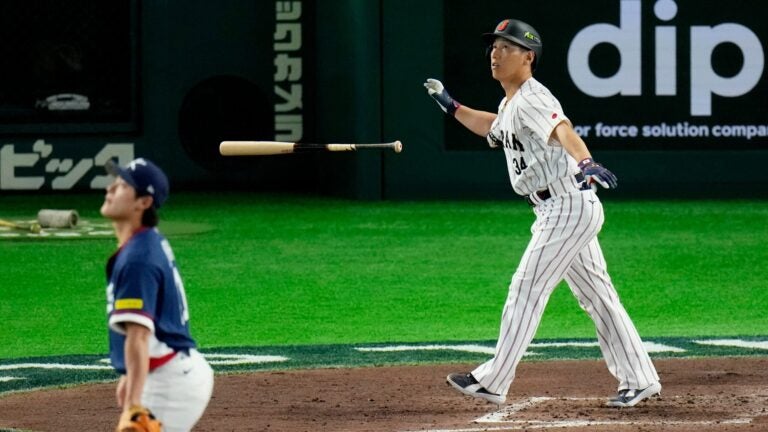 Yoshida hits a home run in Japan's win, with Maye in attendance