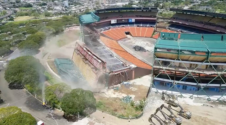 COURTESY ALOHA HALAWA DISTRICT PARTNERS
                                This screenshot made from a drone video shows the first section of Aloha Stadium seating being demolished in Halawa today.