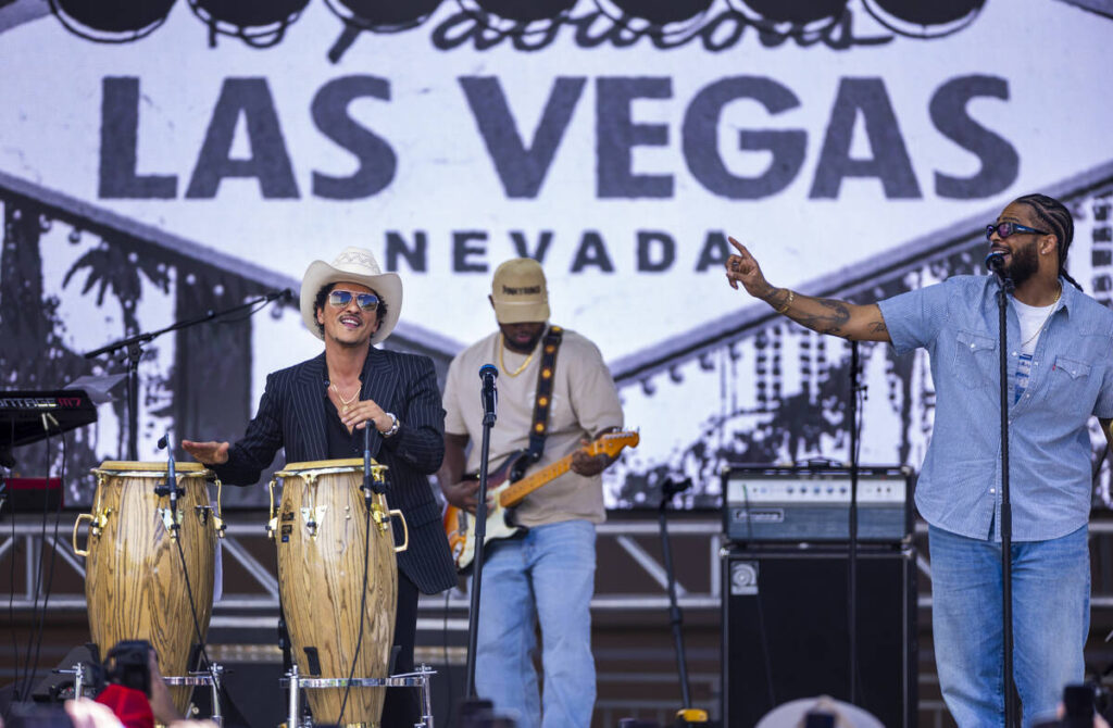 Bruno Mars performs with The Hooligans at Toshiba Plaza after being honored with a parade leadi ...