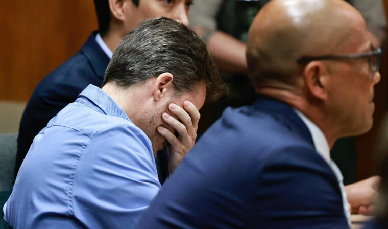 JAMM AQUINO / JAQUINO@STARADVERTISER.COM
                                Gerhardt Konig, middle, buries his face in his hand as the verdict is read today in the circuit courtroom of Judge Paul Wong.