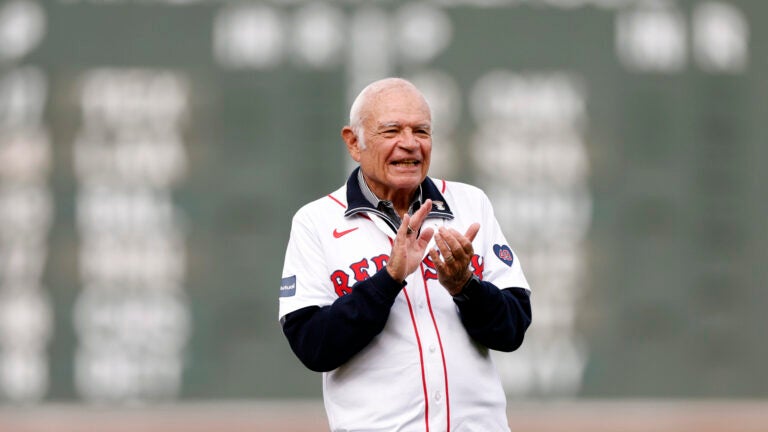 Longtime radio announcer Joe Castiglione is honored with a ceremony on the field before the Boston Red Sox’s final game of the season at Fenway Park.