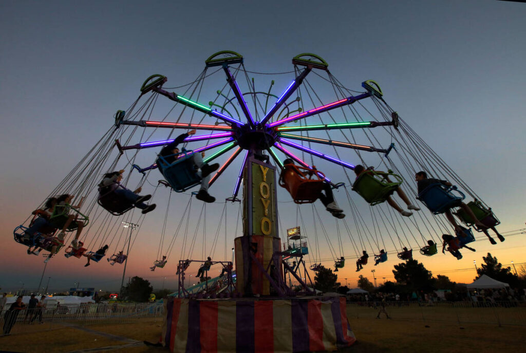 Fairgoers enjoy a ride on the Yo Yo during a Tacos & Tamales festival at Desert Breeze Socc ...