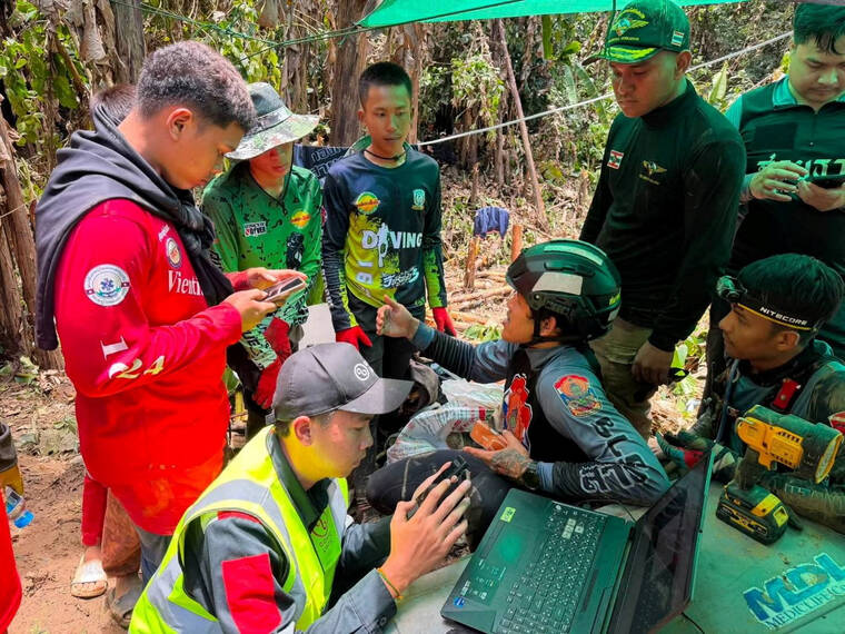 5 found alive in Laos cave; search continues for 2