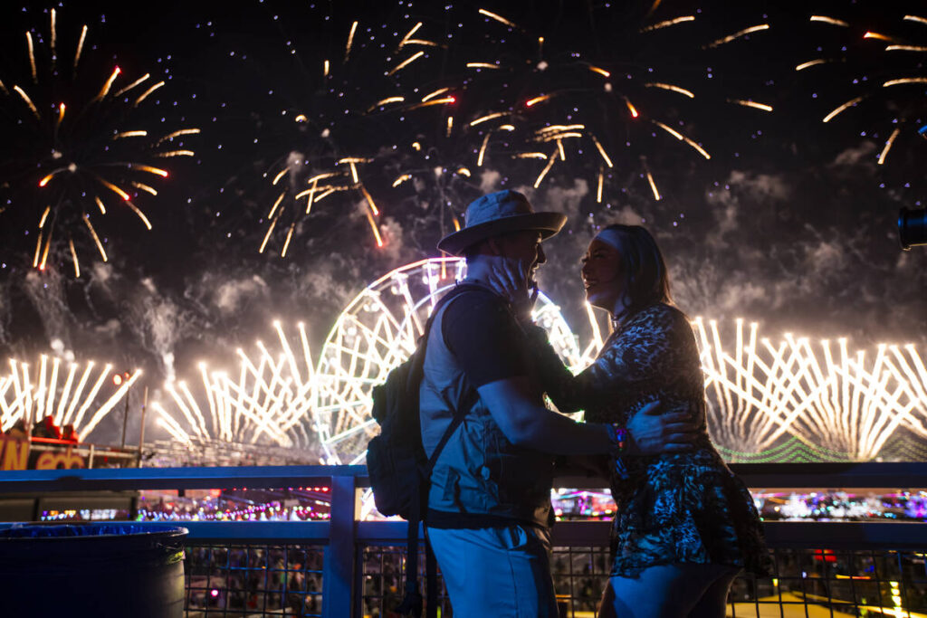 A couple reacts as fireworks go off during the final night of the Electric Daisy Carnival at La ...