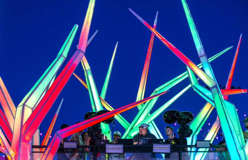 A DJ performs atop the Forest House during the first night of EDC at the Las Vegas Motor Speedw ...