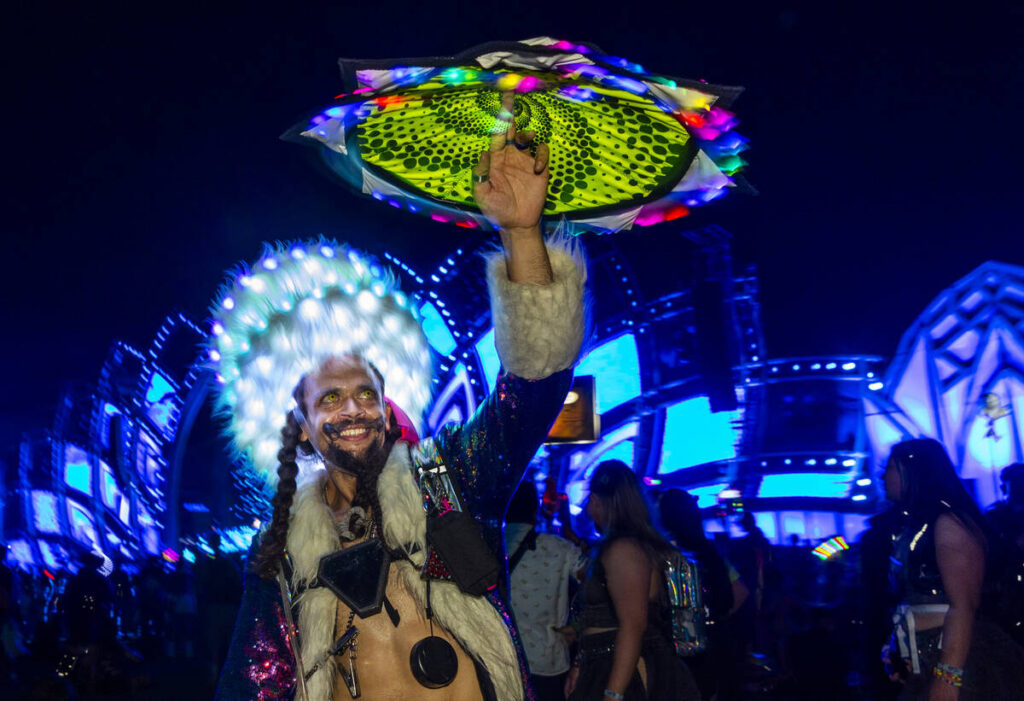 Brandon Anderson twirls an illuminated cloth about the Cosmic Meadow stage during the first nig ...