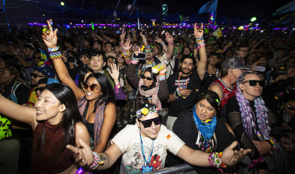 Attendees dance during the final night of the Electric Daisy Carnival at Las Vegas Motor Speedw ...