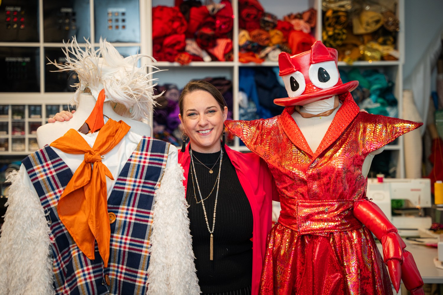 20 weekend events including the Alabama State Games (June 12-14) 5 A costume designer poses with two elaborate Little Mermaid costumes on mannequins in a costume workshop at Red Mountain Theatre