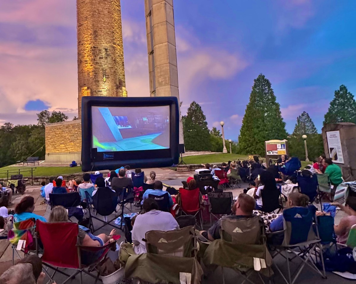 Plan now for these 34 weekend events: July 16-19, 2026 4 Crowd in lawn chairs watching a movie on an inflatable outdoor screen at Vulcan Park & Museum at dusk