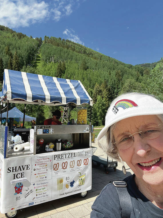 Honolulu traveler Virginia Hinshaw was amused to see a cart offering shave ice amid the mountains surrounding Telluride, Colo. Selfie by Hinshaw.