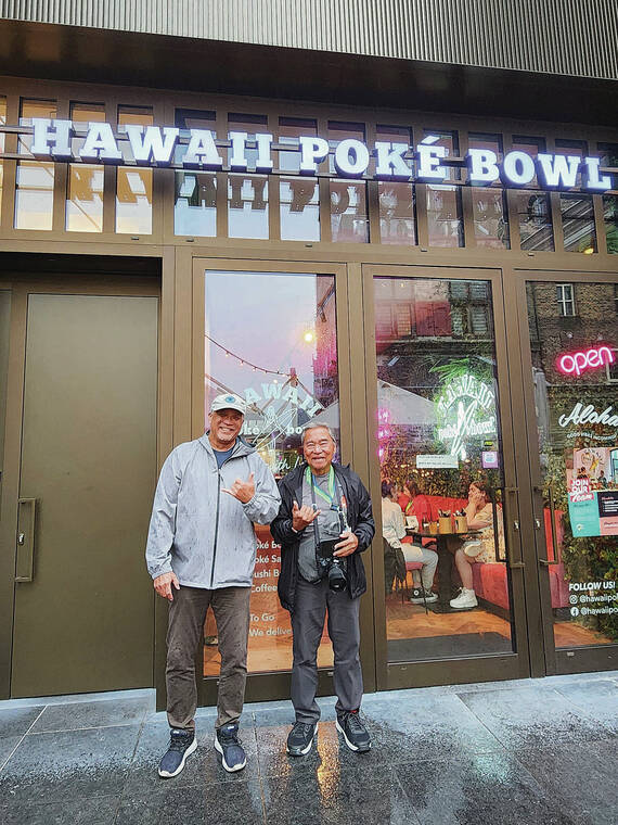 Kaneohe resident Gary Furukawa and Dionicio Pascual Jr. sported shakas for a snapshot at Hawaii Poke Bowl in Delft, Netherlands. Photo by Renee Furukawa.