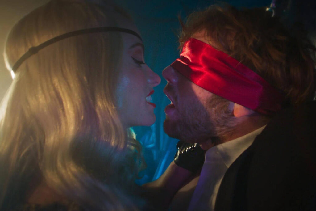 Olivia Wilde and Cooper Hoffman in a scene from "I Want Your Sex." (Magnolia Pictures)