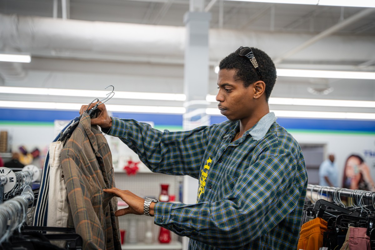 See thrifted looks strut the runway + support a great cause—Aug. 26 8 Designer Odus Smith browsing clothing racks at a Goodwill store, searching for thrift finds to transform into runway looks