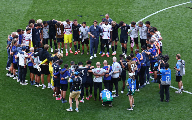 REUTERS/AGUSTIN MARCARIAN
                                The U.S. team huddles after the match as the U.S. is eliminated from the World Cup.