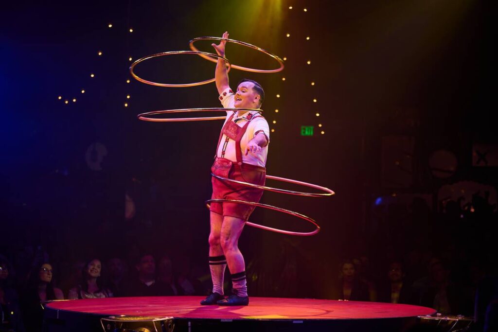Craig Reid performs his hula-hoop act during Absinthe's 14th Anniversary performance, April 8, ...