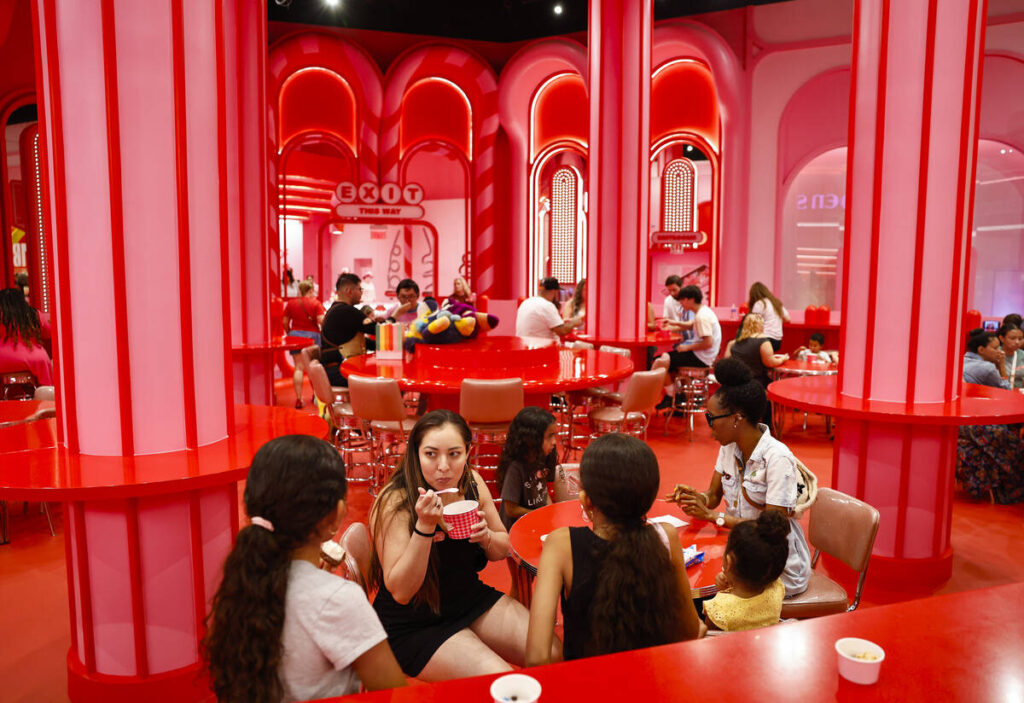 People eat and shop in the cone course during an early walkthrough of the Museum of Ice Cream a ...