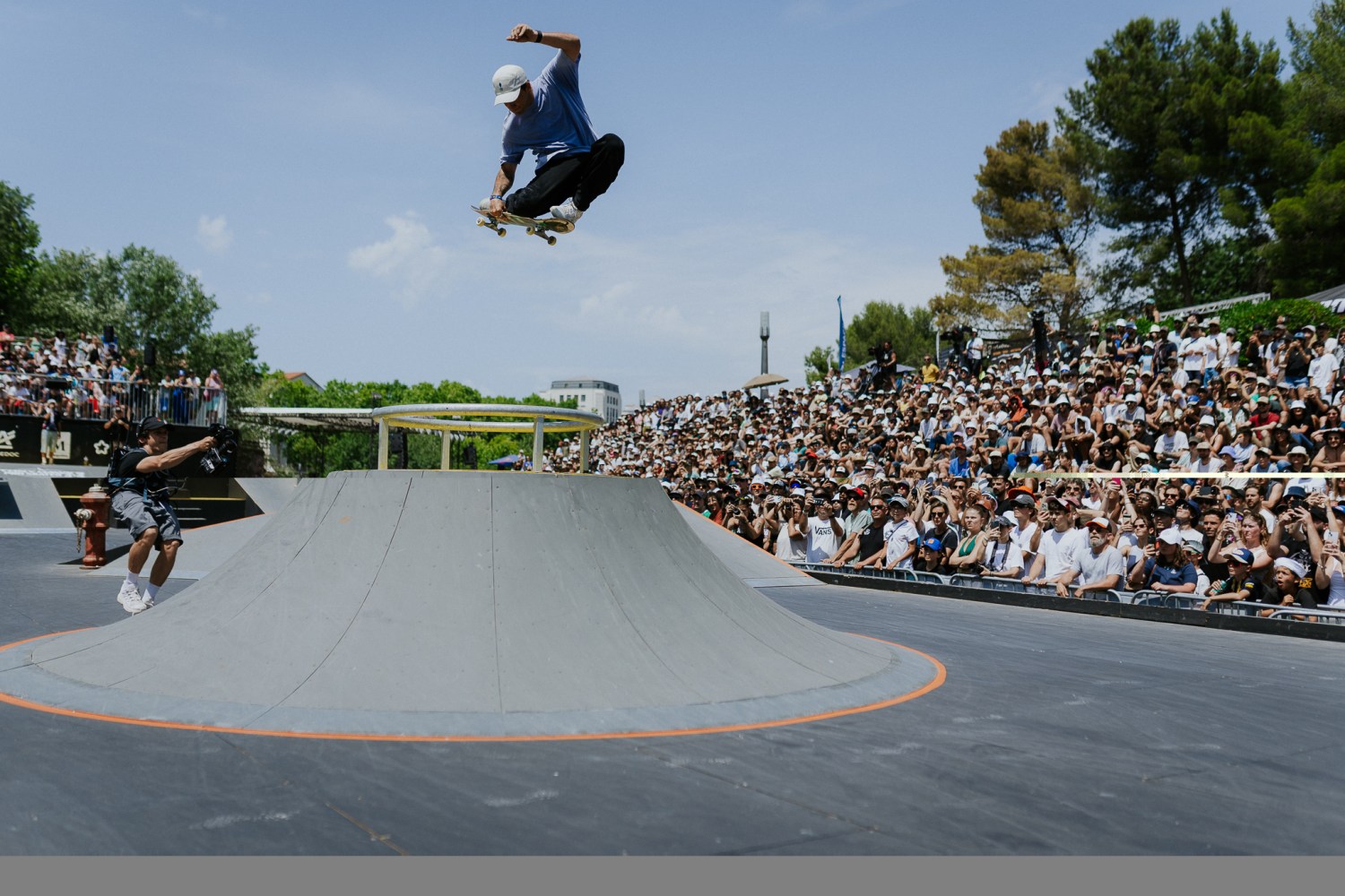 Everything you need to know about FISE in Birmingham Aug 7-9: world-class sports, live music + more 9 Skateboarder performing a trick at an outdoor skate competition with spectators watching in the background