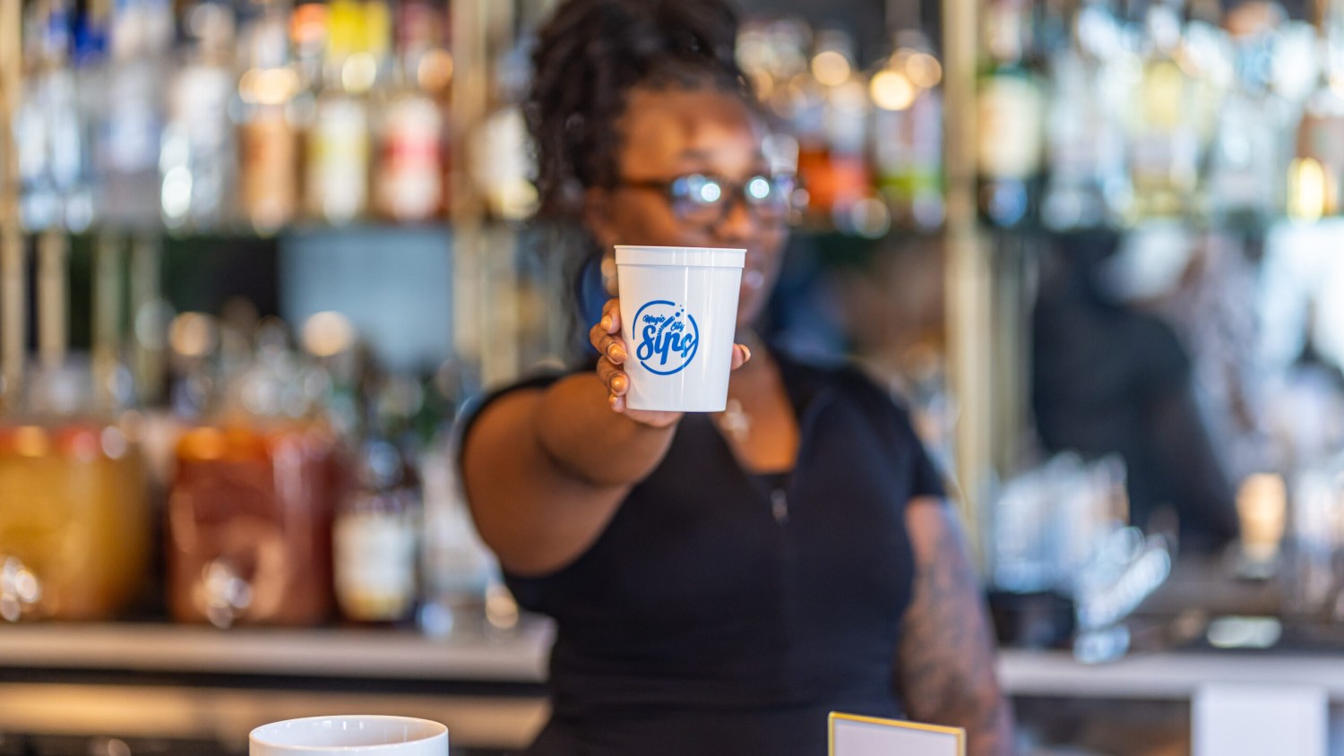 21 weekend events: inclusive circus, ghost hunt + more (Aug. 13-16, 2026) 2 bartender holding cup out in front of themselves