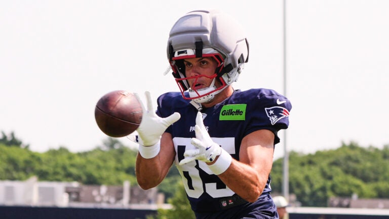 New England Patriots tight end Hunter Henry catches a pass during a NFL football training camp, Tuesday, Aug. 11, 2026, in Foxborough, Mass.