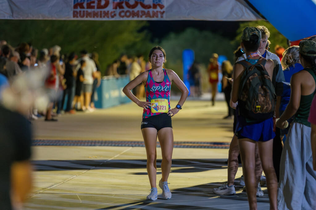 Somerset Academy Sky Pointe’s Aislin McMahon walks away after finishing first in her rac ...