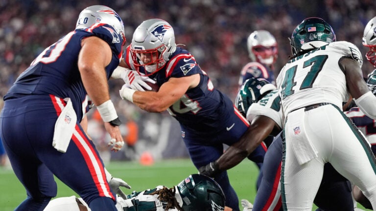 New England Patriots running back Lan Larison (34) scores a touchdown against the Philadelphia Eagles during the second half of an NFL preseason football game, Saturday, Aug. 22, 2026, in Foxborough, Mass.