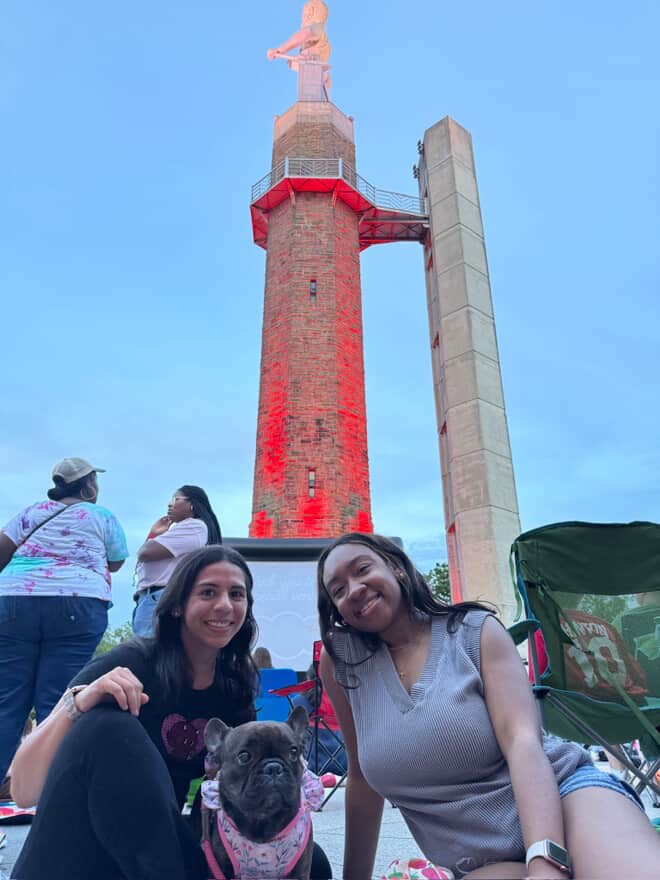 Outdoor Movies in Birmingham: 5 spots to watch this fall 3 friends sitting in front of the vulcan statue