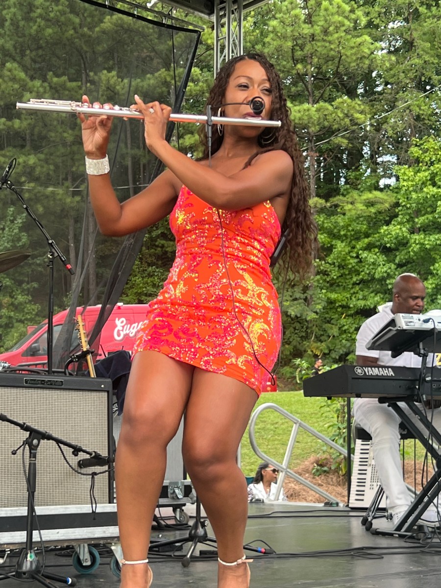 FREE Irondale Music Fest 2026: Tony Tatum + more 2 Flutist Sherry Reeves performs on stage during outdoor festival, with keyboard player in background