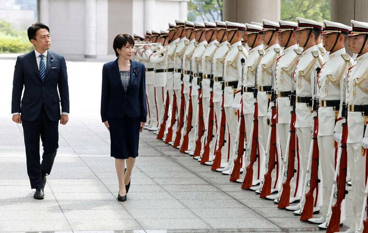 REUTERS/KIM KYUNG-HOON/POOL
                                Japanese Prime Minister Sanae Takaichi and Defense Minister Shinjiro Koizumi inspect the honor guard at the Self-Defense Forces Senior Commanders Conference in Tokyo, Japan, on Sept. 2. A candidate backed by Japanese Prime Minister Sanae Takaichis government won Okinawas gubernatorial election on Sunday, ousting an opponent of Tokyos military build-up across the strategically important island chain near Taiwan and China.