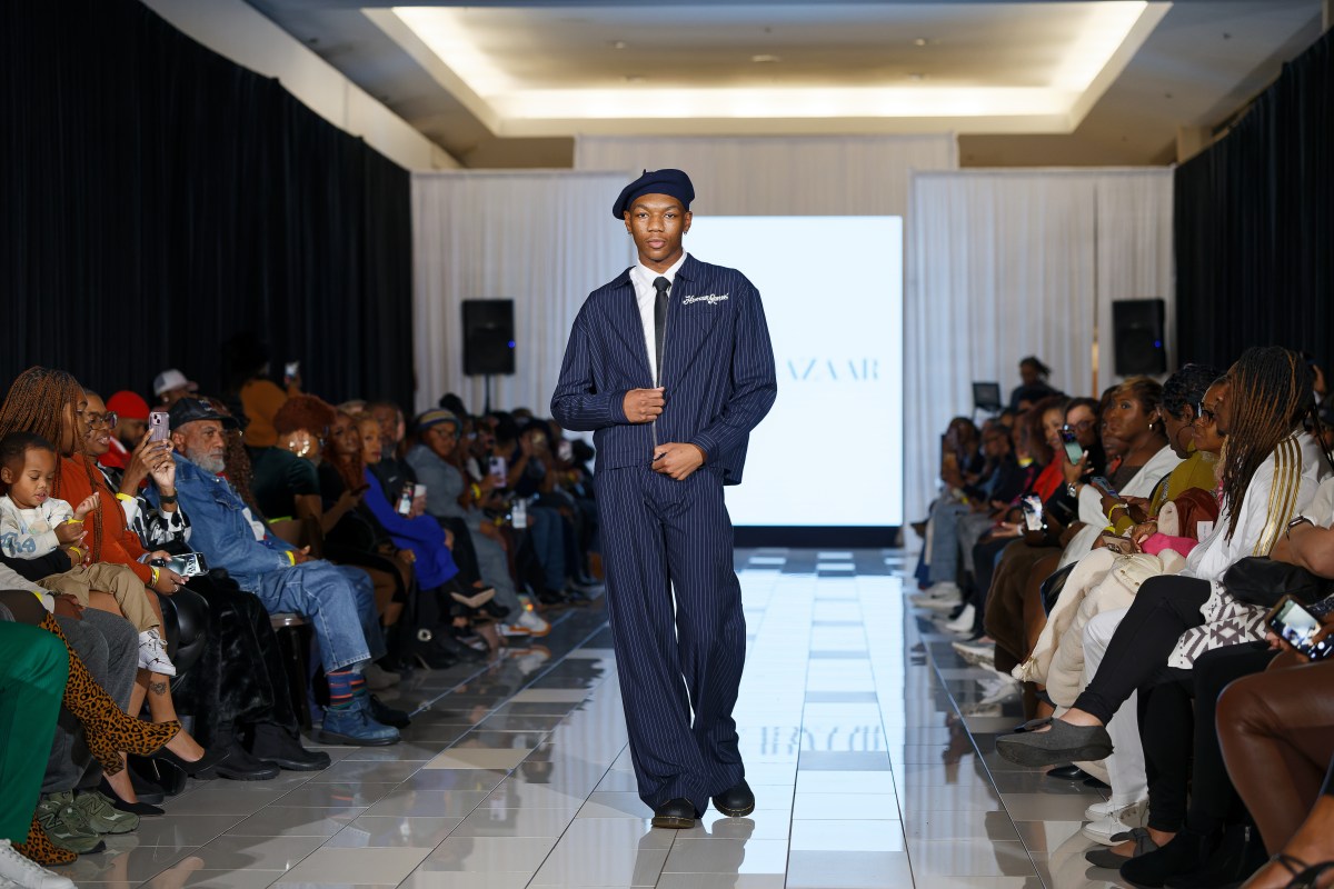 See local designers at this Birmingham fashion show—get tickets now for Sept. 27 2 male model in navy blue suit walking on runway