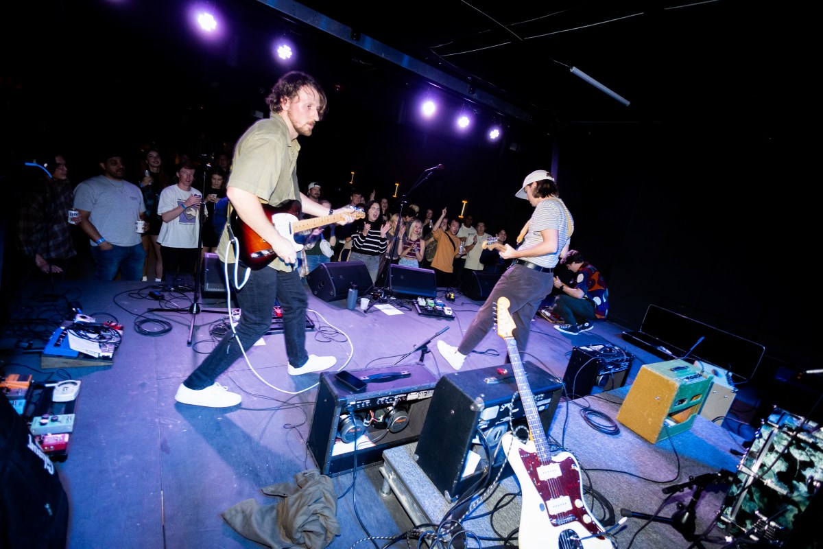 The backstage view of a band performing live at Woodlawn Theatre. 