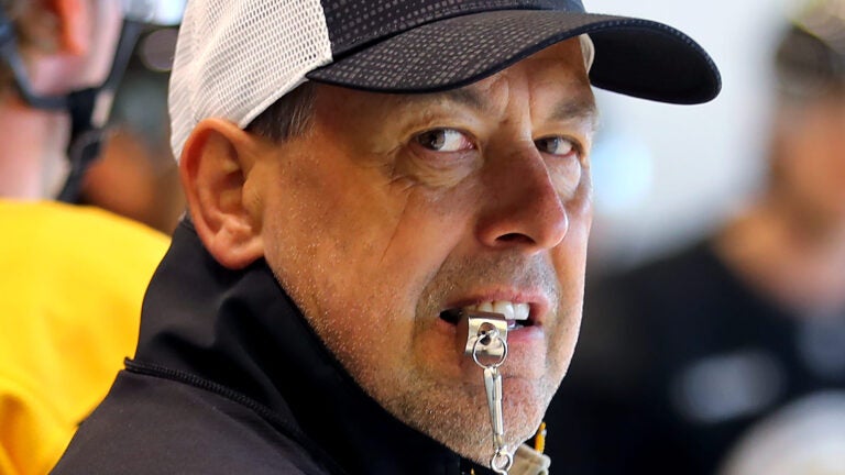 The Boston Bruins held training camp at Warrior Ice Arena. Coach Marco Sturm looks over his players during a drill.