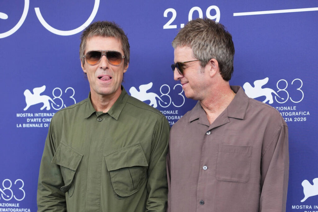 Liam Gallagher, left, and Noel Gallagher pose for photographers at the photo call for the film ...